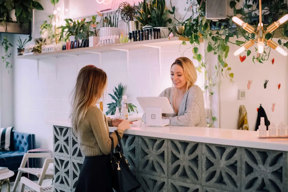 Local business owner helping a customer